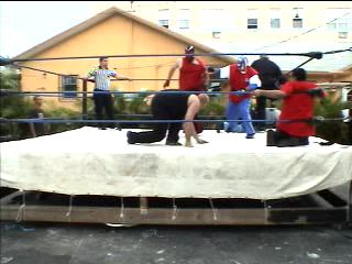 AJ throws Skorpio to the corner