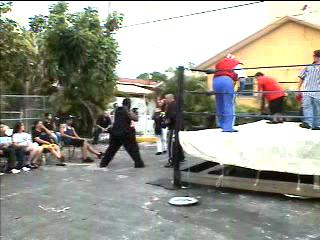 Crippler attacks Kage with a series of punches