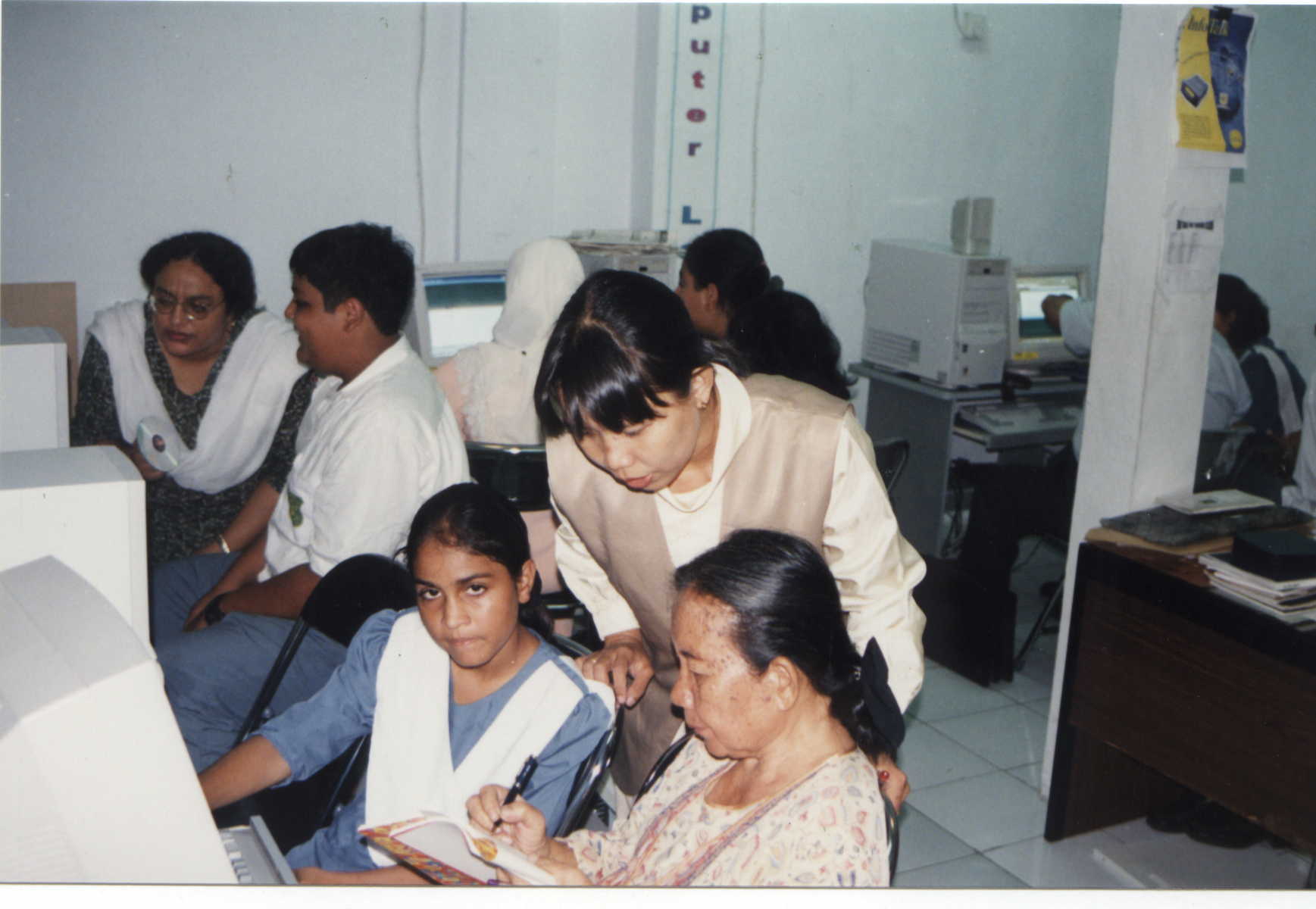 Students teach some of our teachers to use computers