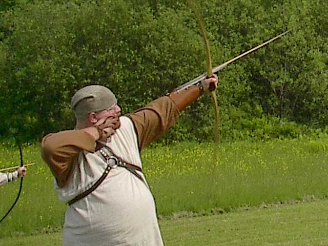 [firing an arrow]