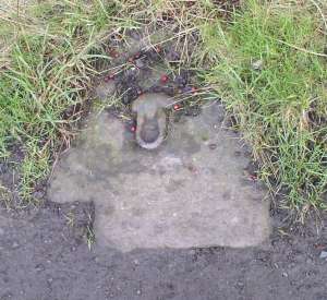 Mooring stone with iron shackle