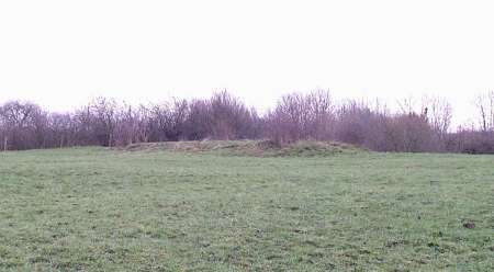 Remains of tram road embankment in field