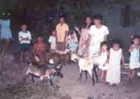 Women and children in Isabel posing with their goats