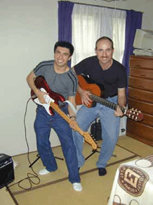 PLAYING THE GUITAR WITH A FRIEND