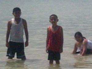 children by the beach