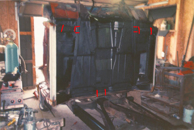 Areas in red indicate where i cut the front cab mount area and notched the rear brace. (*note i did not mark on this pic where the floor has to be raised)