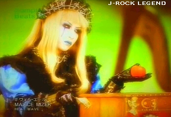 ...and the same scene of Mana-sama, except here, he's..staring..at the tomato..WHY is he staring at the tomato.. o.o