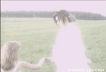 and the little girl, who is dying after being caught in the fire, walks to her angel...