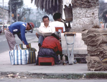 Shoeshine on main street, Ibarra, north of Otavalo, 1984