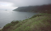 Photo of coast and hills on Ilha Grande, Brazil, historic home of pirates, prisoners and slaves, 2002. LINK to photo portfolio