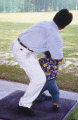 Zacchaeus trying a hand at golf with some help