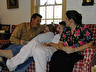 dad trying to tickle me.. everyone else laughs.