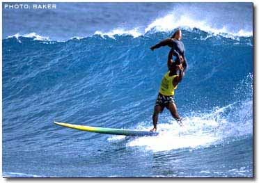 Great strength, balance and flexibility is needed for tandem surfing.