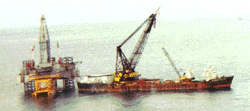 The Ocean Builder, and a drilling rig