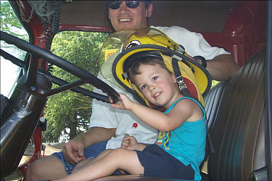 Jason and Hayden in a California Department of Forestry firetruck