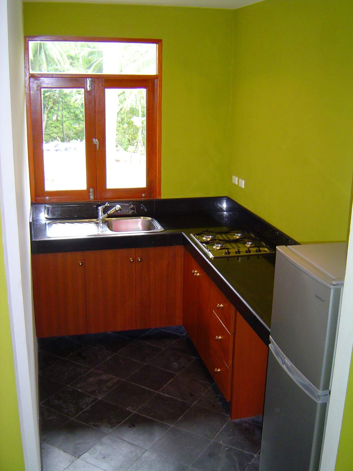 The kitchen with black marble top.