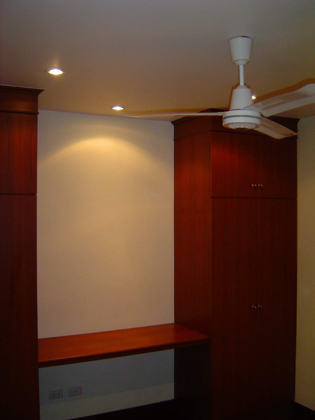 the closets in the second bedroom with in between the small desk 
