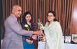 Student recieving prize.