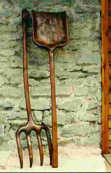Shovel and forked stick. Carved in a only wooden piece