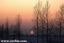 winter sunset by corbis.com