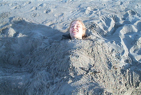 Gillian buried in sand