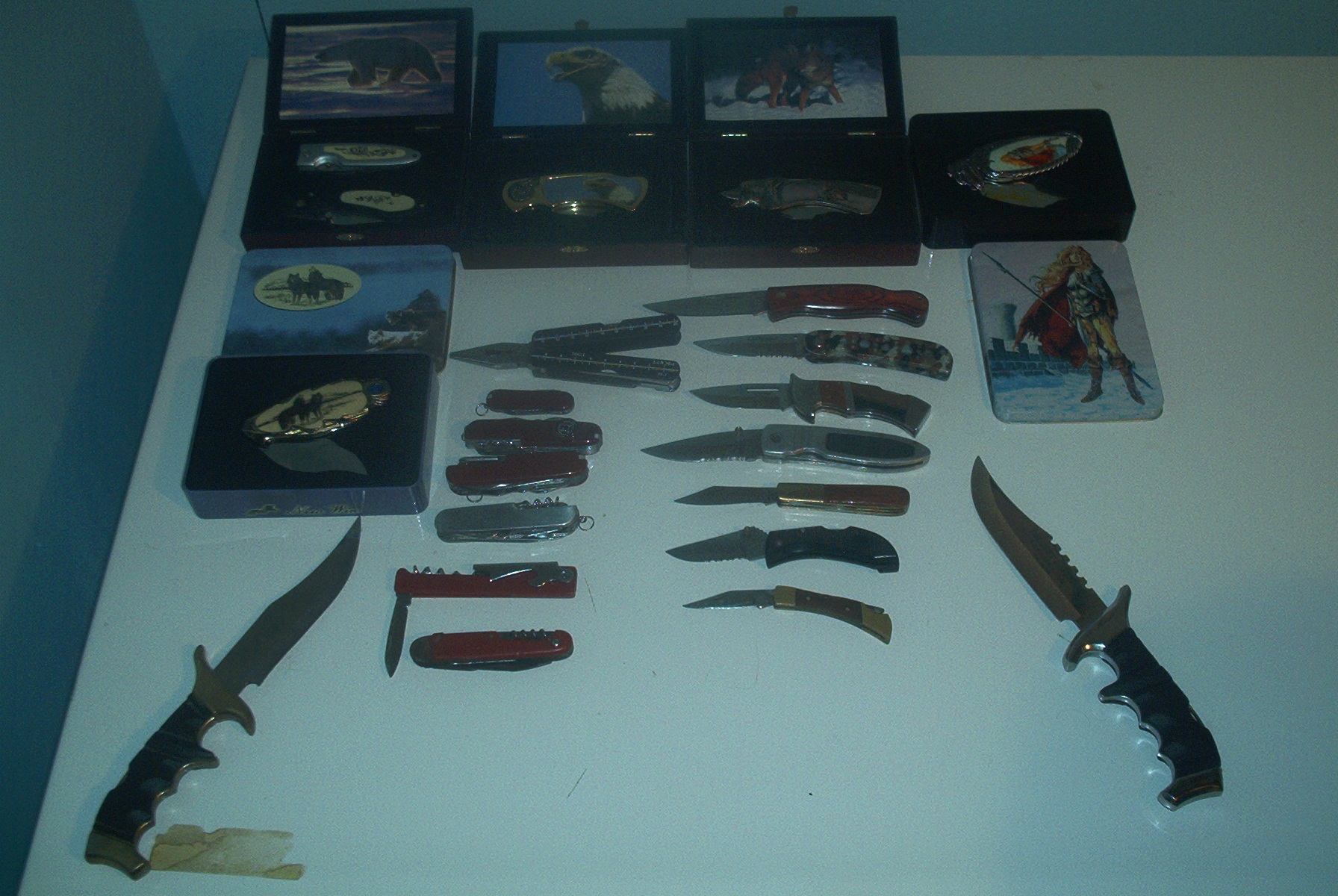 My knife collection, I plan on getting a pic of each alone so you can get a better look at them, there are acouple missing from this pic though, one swiss army knife was stolen from me when I was in grade 9 and my father has one knife somewhere, I forgot to get it and add it in.&nbsp; I also forgot to put my fathers hunting knife in the shot, it'll be added later