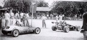 two formula one race cars pulling onto Central Avenue, 1979