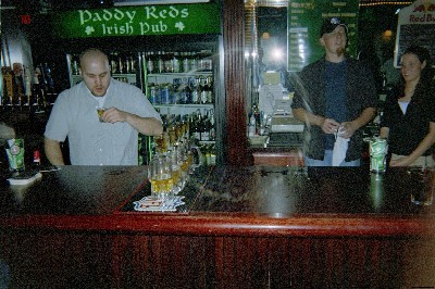 A crazy bartender who is taking a shot of 151