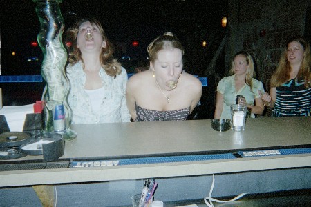 Renee and Karyn taking a crack at a blowjob.