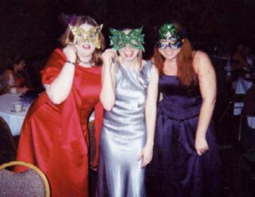 Mary-Michael, Me, and Kelly putting on the Mardi Gras masks