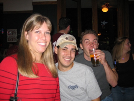 Jill and Chris and Nick making a funny face in the background