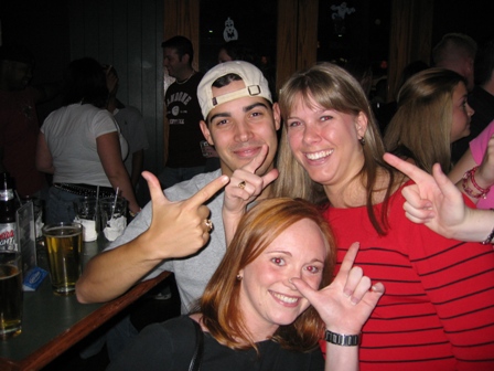 Chris, Jill, and Carol holding their guns up cuz they are all Red Raiders