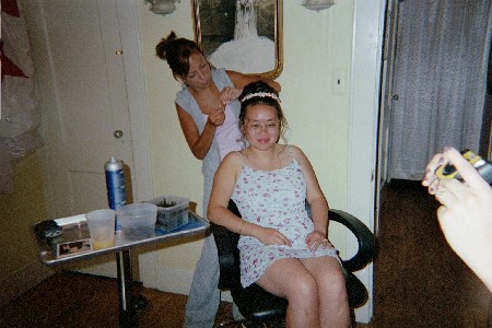 Janice getting her hair done before the wedding.