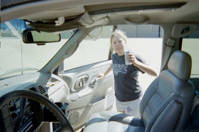 Sam taking a drunken picture of me after the mud run stumbling into his car