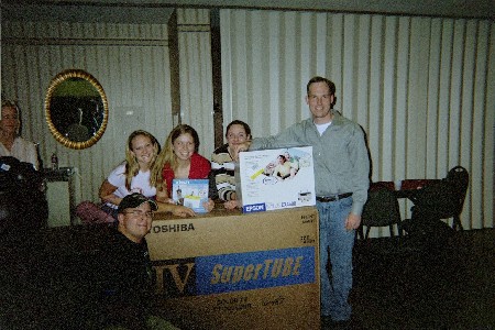 Bond with his big screen tv, Liz, Me with my color phone, Nina, and Shane with his scanner/printer, all prizes from casino nite