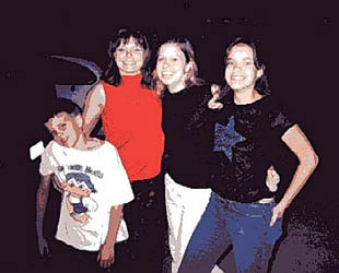 A little distorted pic (my nephew Brennan, my oldest sister Laura, me, and my niece Brianna)...I know, none of us look alike either!