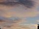 CloudedSunSetting.jpg