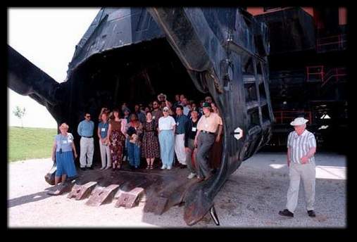 GROUP STANDING IN BUCKET OF&nbsp; BIG BRUTUS 