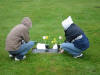 Two of Peter's friends at his gravesite, 03-25-2004.  Photo credit:  Megan R.
