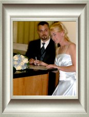 Brett and Heidi signing the marriage certificate.