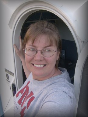 Me-hanging out the door of our trailer