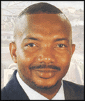 Hon. Michael Perkins, Minister of Physical Planning, Infra-Structural Development, Natural Resources and Environment