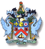 THE COAT OF ARMS: The center of the coat of arms is dominated by a shield at the base of which is a lighter in full sail. A red chevron is highlighted by two poinciana flowers. At the top of the shield is the head of a Carib, supported by the fleur-de-lis and a rose. These symbols represent the early inhabitants of the islands, and the influences of the French and English.