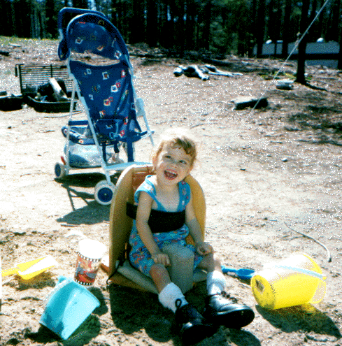 Emily in her corner chair while camping