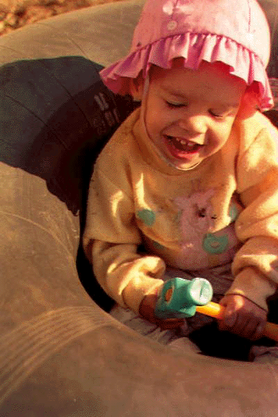 Emily sitting in intertube outside