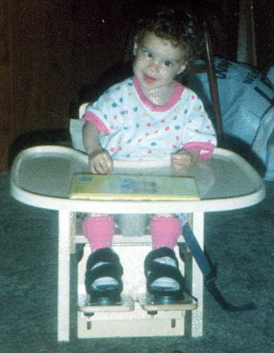 Emily in her toddler chair
