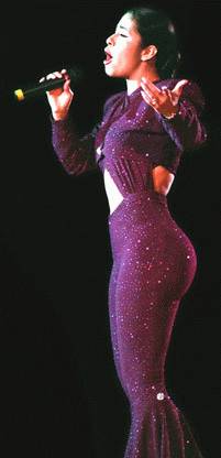 selena in purple jumpsuit