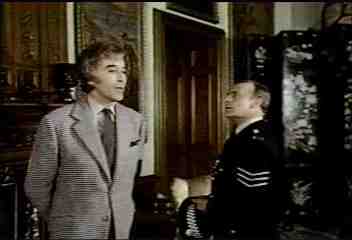 Edward Woodward's eyes widen in horror at the sight of Christopher's appalling Suzi Quatro shag in "The Wicker Man."