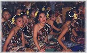 amidst the Lao New Year celebrations - a group of young Lao girls resting after a traditional Lao Dancing performance