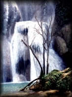 view of the second level of the enticing Kuang Xi Waterfall, Luarng Prabang - huge cascades over naturally aged limestone structures